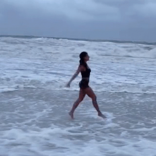 Woman Cartwheel In The Beach GIF