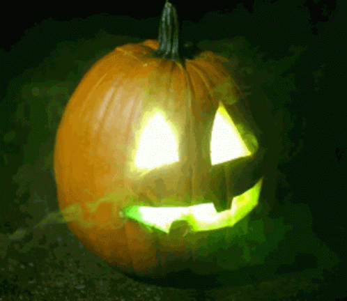 Carved Pumpkin with Green Light