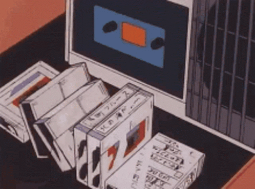 Cassette Tapes in Front of Computer Monitor