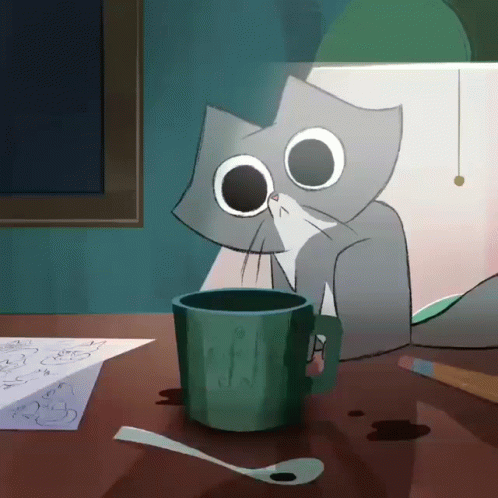 Cat at Table With Cup of Coffee