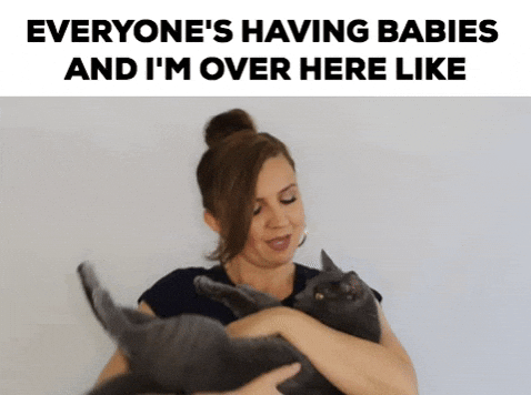 Cat Lady Carrying Pet Like Baby GIF