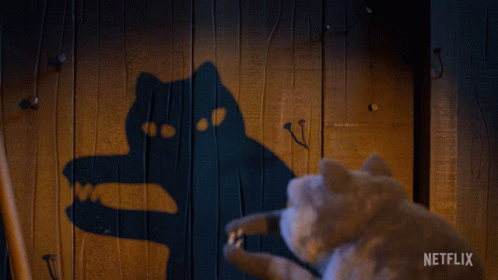 Cat Looking at Cat Shadow Saying Netflix