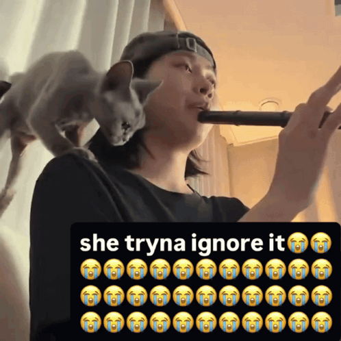 Cat on Man's Shoulder Saying She Tryna Ignore It