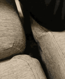 Cat Peeking Through Sofa GIF