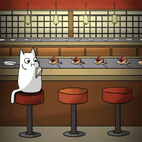 Cat Sitting On Bar Stool At Conveyor Belt With Cakes GIF