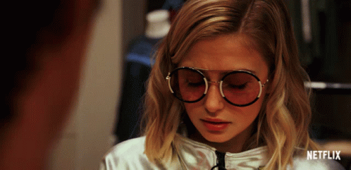 Cat Sitting on Counter in Restaurant With Coffee