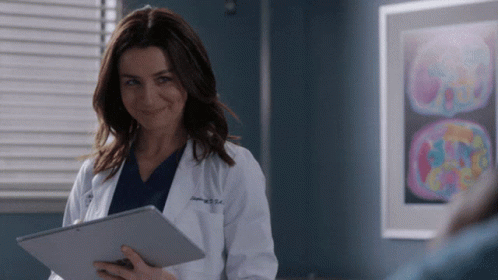 Caterina Scorsone As Amelia Shepherd Taking Notes Smiling GIF