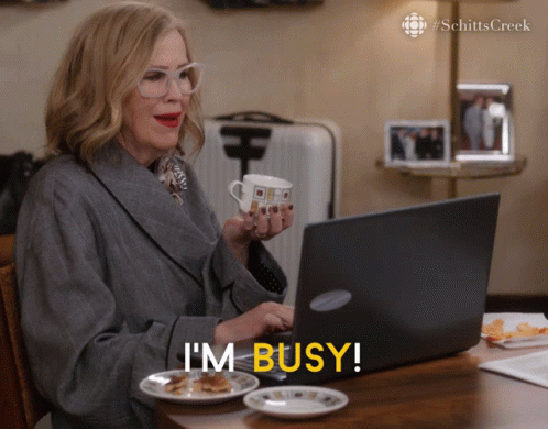 Catherine O Hara Pretending To Work Im Busy GIF