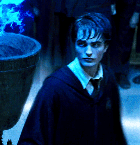 Cedric Diggory Touching Blue Fire GIF