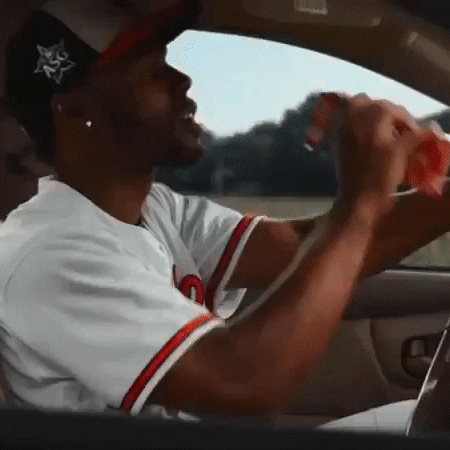 Cedric Mullins Eating While Driving GIF