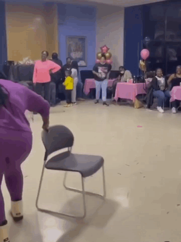 Chair Broken By Woman In Purple GIF