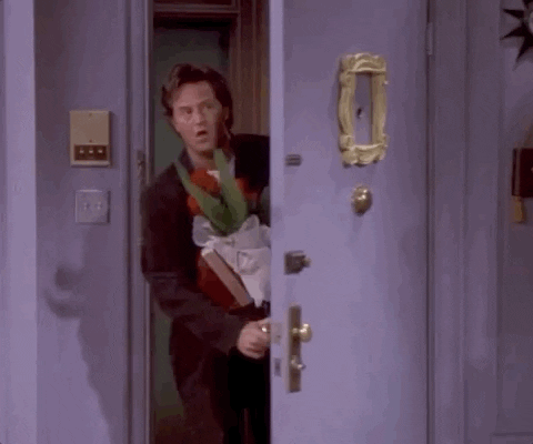 Chandler Bing Bringing Flowers Happy Valentine's Day GIF