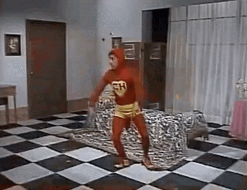 Chapulín Colorado Is Dancing On A Checkered Floor In A Room . GIF
