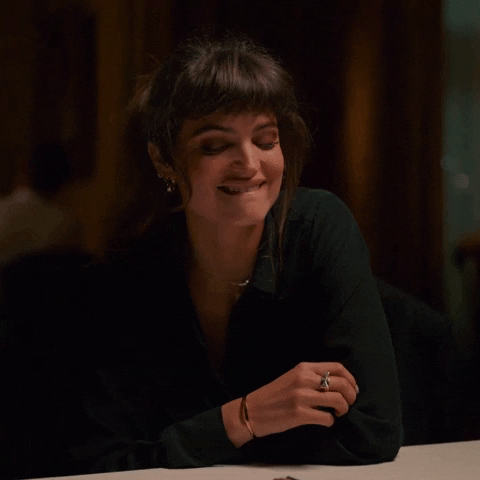 Charlbi Dean Chuckle GIF