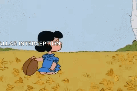 Charlie Brown And Lucy Brown Are Playing In A Field And Charlie Brown Is Holding Lucy Brown In The Air . GIF
