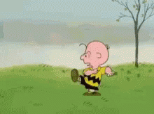 Charlie Brown From The Peanuts Cartoon Is Running In A Field . GIF