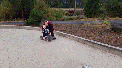 Charming Father Son Skateboard Bonding GIF