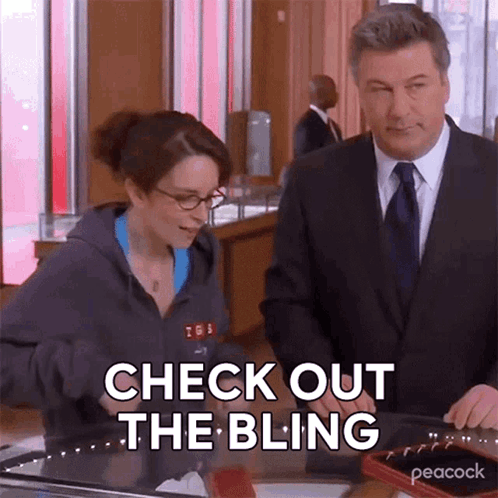 Check Out the Bling Suit Man and Hoodie Woman