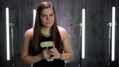 Cheerleader In Purdue Uniform Making Face GIF