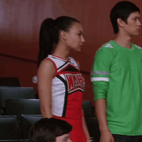 Cheerleader in Red and White Uniform Saying Wives