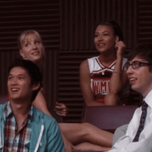 Cheerleader in UCSD Jersey Beside Man