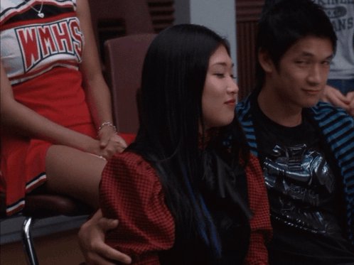 Cheerleader in WMHS Jersey Sitting Next to Boy