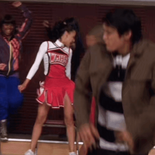 Cheerleader in WMHS Uniform Dancing With Man