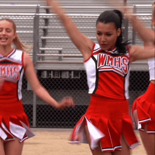 Cheerleader In WMHS Uniform Holding Arms Up GIF