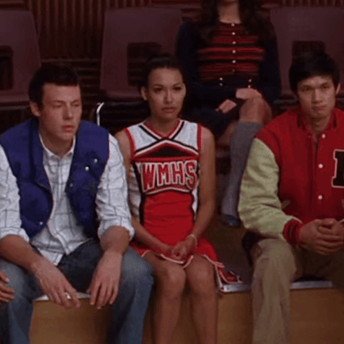Cheerleader in WMHS Uniform Sitting Next to Man