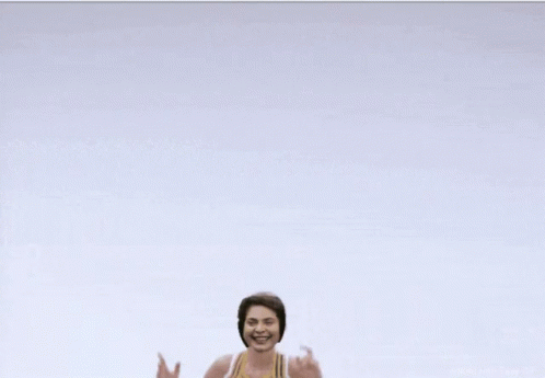 Cheerleader in Yellow and White Top With Letter E