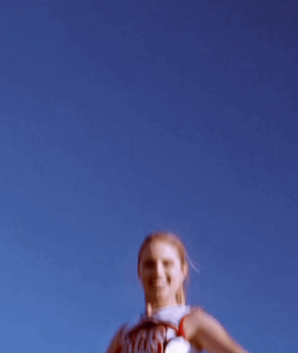 Cheerleader Jumping in Uniform Saying WHS