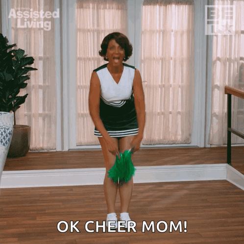 Cheerleader Saying Ok Cheer Mom With Green Pom Pom GIF