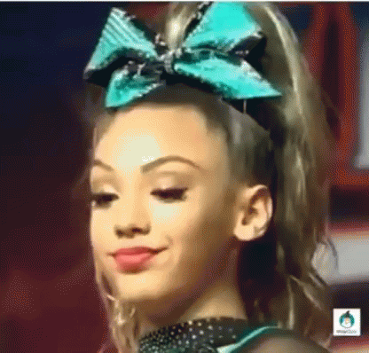 Cheerleader with Blue Bow Smiling