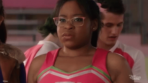 Cheerleader With Glasses and Pink Top