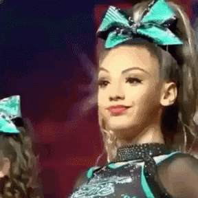 Cheerleader With Green Bow Smiling