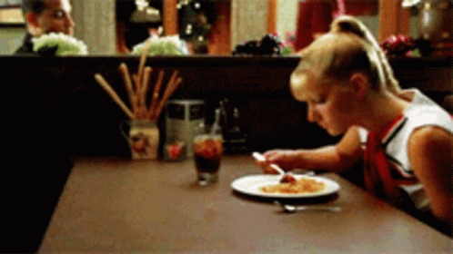 Cheerleader With Plate of Food