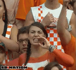 Cheerleaders Dancing in Front of Mascot in T-Shirt