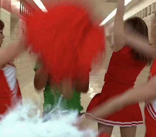 Cheerleaders Dancing in Hallway One Wearing Red