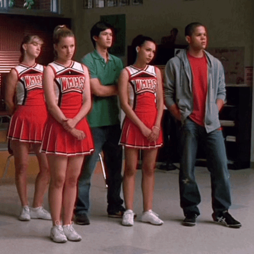 Cheerleaders in WMHS Uniforms Standing in Row