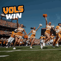 Cheerleaders On A Football Field With The Words Vols Win Behind Them GIF