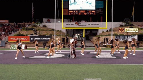 Cheerleaders on Football Field With Scoreboard 25 Seconds Left