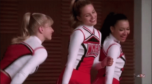 Cheerleaders Standing Next To Each Other GIF