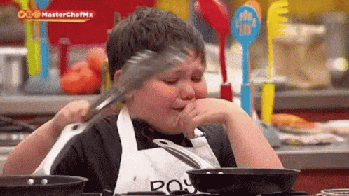 Young Chef Cooking While Crying GIF