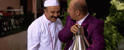 Chef And Man In Purple Suit Talking GIF