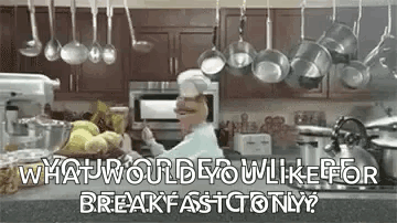 Chef Cooking in Kitchen with Pots and Blender