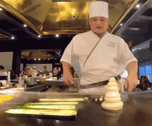 Chef Cooking Vegetables on Stove
