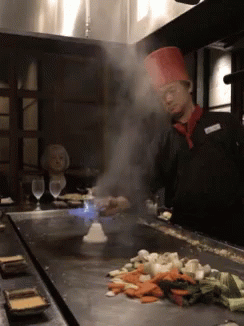 Chef in Red Hat Cooking Vegetables