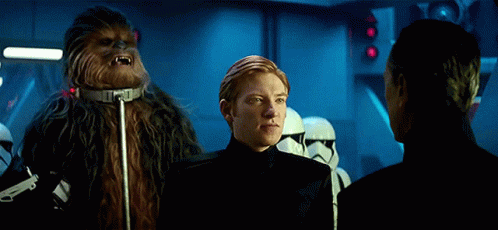 Chewbacca Standing Next to Two Men