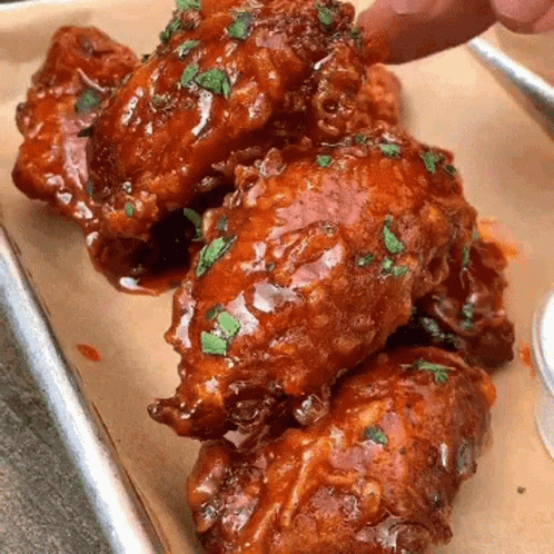 Chicken Wing Dipped In Sauce With Herbs GIF