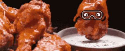 Chicken Wing With Goggles Dipped In Sauce GIF
